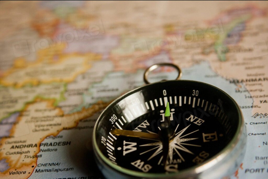 A compass placed on a map